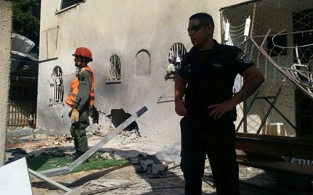 Police and emergency services at the site of the Ashdod synagogue hit by a Gaza rocket, August 22, 2014. (Photo credit: Israel Police) Police and emergency services at the site of the Ashdod synagogue hit by a Gaza rocket, August 22, 2014. (Photo credit: Israel Police)