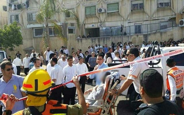 Emergency services evacuate a man injured by shrapnel from a Gaza rocket that hit Ashdod synagogue, August 22, 2014. (Photo credit: Israel Police) Emergency services evacuate a man injured by shrapnel from a Gaza rocket that hit Ashdod synagogue, August 22, 2014. (Photo credit: Israel Police)