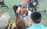 Israeli tennis player Dudi Sela greets Jewish fans after his victorious US Open match August 28, 2014. (Howard Blas/The Times of Israel)