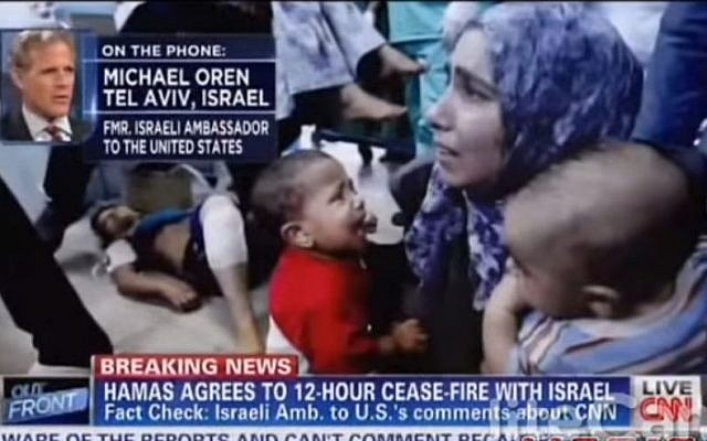 Michael Oren, interviewed on CNN on a screen filled with images from Gaza (YouTube screenshot) Michael Oren, interviewed on CNN on a screen filled with images from Gaza (YouTube screenshot)