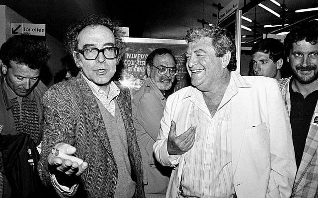 Israeli producer Menahem Golan, right, and movie director Jean-Luc Godard, left, speak to the press in Cannes, France, after the screening of Godard's out of competition "King Lear," produced by Golan's Cannon group, May 17, 1987 (Photo credit: Pierre Gleizes/AP, File) Israeli producer Menahem Golan, right, and movie director Jean-Luc Godard, left, speak to the press in Cannes, France, after the screening of Godard's out of competition "King Lear," produced by Golan's Cannon group, May 17, 1987 (Photo credit: Pierre Gleizes/AP, File)