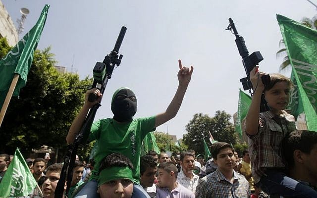 Palestinian boys with Hamas supporters hold toy guns and shout slogans during a demonstration in the West Bank city of Nablus on Friday, Aug. 15, 2014. (photo credit: AP Photo/Nasser Ishtayeh)