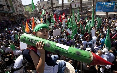 A Palestinian boy holds a model rocket at a Hamas demonstration in the West Bank city of Ramallah, Friday, Aug. 22, 2014. (photo credit: AP Photo/Majdi Mohammed) A Palestinian boy holds a model rocket at a Hamas demonstration in the West Bank city of Ramallah, Friday, Aug. 22, 2014. (photo credit: AP Photo/Majdi Mohammed)