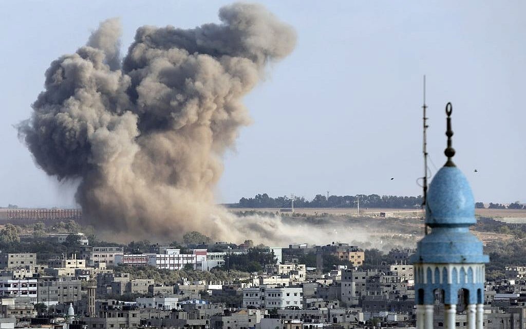 Smoke from an Israeli strike rises over Gaza City, Gaza Strip, Saturday, August 9, 2014.(photo credit: AP/Lefteris Pitarakis)