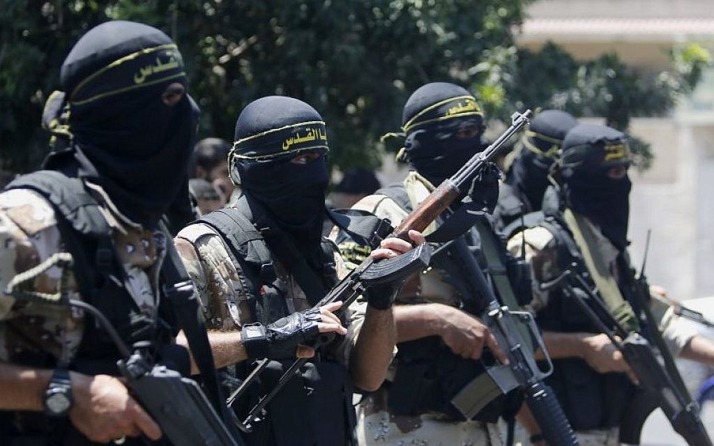 Masked militants of the Islamic Jihad group march during the funeral of their comrade Shaaban Al-Dahdouh, whose body was found under the rubble Tuesday, in Gaza City on Wednesday, Aug. 6, 2014. (Photo credit:AP/Hatem Moussa)