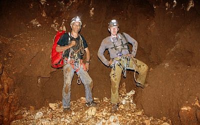 Vladimir Buslov and Yuri Lisovic from the Hebrew University’s Cave Research Unit stand 187 meters below ground at the bottom of Israel’s deepest cave. (Photo: Boaz Langford, Hebrew University Cave Research Unit)