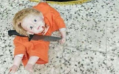 A photo of a decapitated doll uploaded to Twitter by supporters of the Islamic State, August 25, 2014. (photo credit: Twitter)