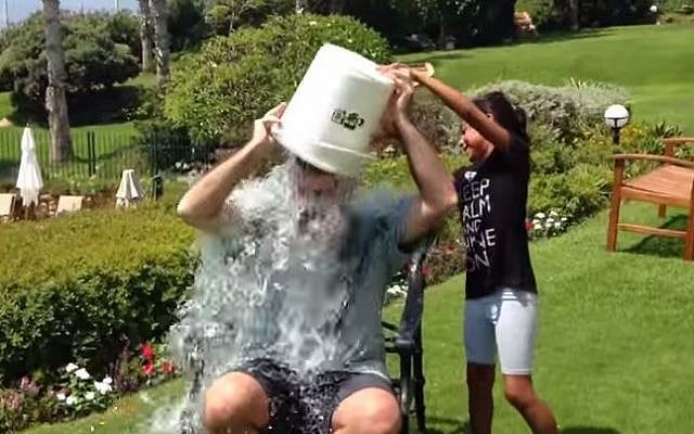 US ambassador Dan Shapiro getting icy water poured on his head. (photo credit: YouTube screen capture)
