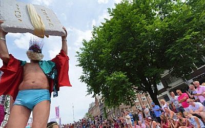 Passengers on the Jewish boat at the Amsterdam gay pride parade, Aug. 2, 2014. (Cnaan Liphshiz/JTA)