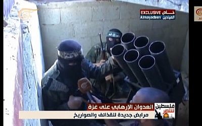In footage captured by al-Mayadeen, apparently during the current truce, Hamas Izz ad-Din al-Qassam Brigades fighters are seen preparing rockets to launch against Israel in a tunnel underneath the Gaza Strip. (screen capture, YouTube) In footage captured by al-Mayadeen, apparently during the current truce, Hamas Izz ad-Din al-Qassam Brigades fighters are seen preparing rockets to launch against Israel in a tunnel underneath the Gaza Strip. (screen capture, YouTube)