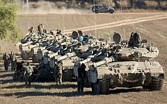 Illustrative: A convoy of IDF tanks park at a deployment area near the border with the Gaza Strip on August 2, 2014. (Yonatan Sindel/Flash90)