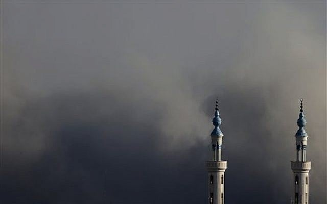 Smoke rises over Gaza City after an Israeli strike on Friday, Aug. 8, 2014 (photo credit: AP/Hatem Moussa) Smoke rises over Gaza City after an Israeli strike on Friday, Aug. 8, 2014 (photo credit: AP/Hatem Moussa)