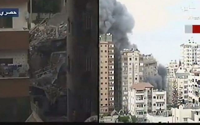 Screenshot from a video showing the collapse of a Gaza apartment building after it was targeted in an Israeli aistrike, August 23, 2014. Screenshot from a video showing the collapse of a Gaza apartment building after it was targeted in an Israeli aistrike, August 23, 2014.