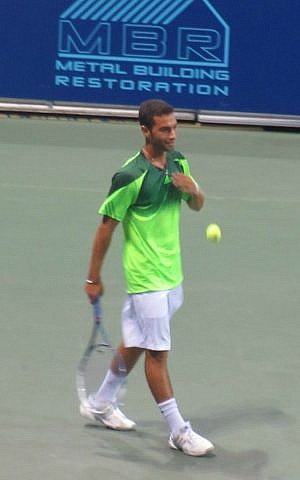 Noah Rubin at benefit game with No. 1 ranked tennis star Serbian Novak Djokovic in New York, August 21, 2014. (Howard Blas/The Times of Israel)