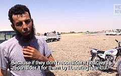 VICE reporter Medyan Dairieh interviews an Islamic State member in Raqqa. (screen capture: YouTube)