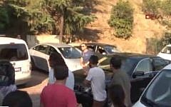 Scene outside the Karokos apartment building in Istanbul, Turkey, where the couple was found stabbed to death, August 22, 2014. (Screenshot from Hurriyet TV/DHA)