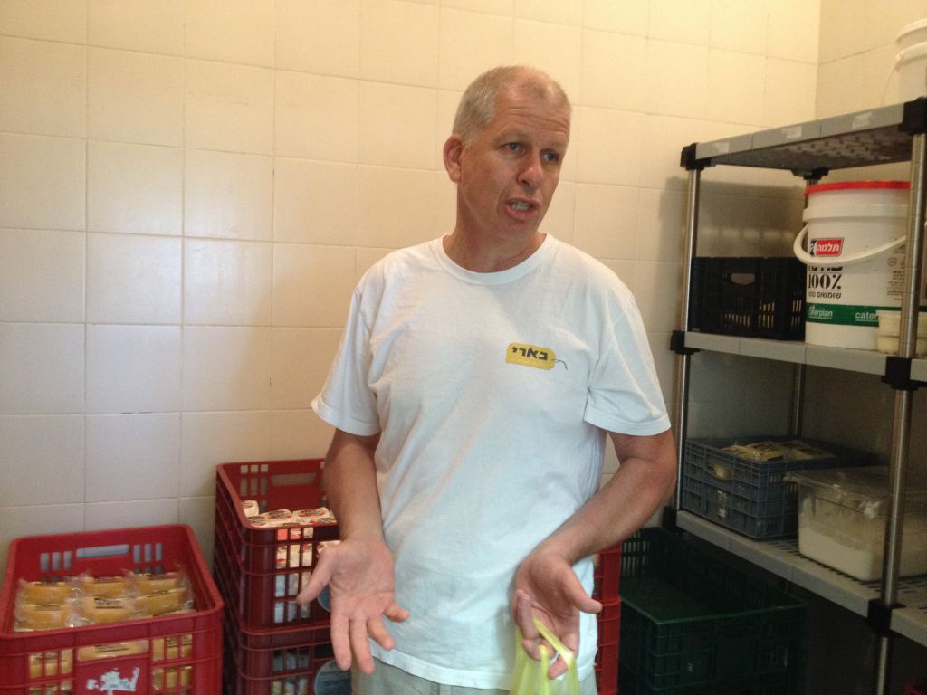 Cheesemaker Dagan Peleg says it's been rough living on the border with Gaza, but he wouldn't want to make cheese -- or live -- anywhere else (photo credit: Jessica Steinberg/Times of Israel)