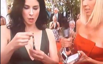 Sarah Silverman and her marijuana smoking device on the red carpet at the 2014 Emmy Awards. photo credit: YouTube screen capture)