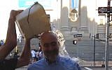 Ron Prosor, Israel's ambassador to the UN, is dowsed with ice water as part of the ALS Ice Bucket Challenge, in a video released Tuesday, August 19, 2014 (screen capture: YouTube)