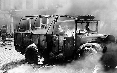 Damage done by a V-2 on a main intersection in Antwerp, on a main supply line to Holland, November, 1944 (photo credit: National Archives and Records Administration/ public domain)