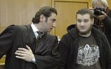 German alleged jihadist Kreshnik Berisha (right) listens to his lawyer Mutlu Guenal (left) as he arrives at the higher regional court in Frankfurt am Main, western Germany, on September 15, 2014 on the opening of his trial on charges of fighting for the Islamic State (IS) in Syria. (photo credit: AFP/Thomas Kienzle)