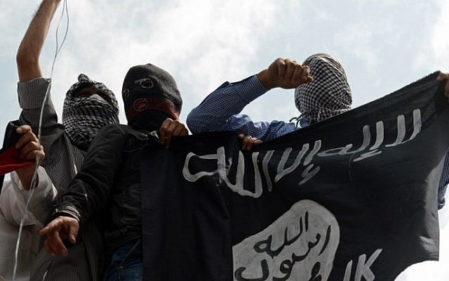 Illustrative photo of men holding up an Islamic State flag. (AFP/Tauseef Mustafa)