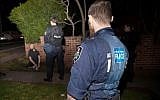 Illustrative: Australian Federal Police officers detain a suspect a counterterrorism raid in Sydney, September 18, 2014. (AFP/Australian Federal Police)