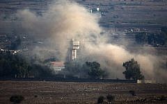 In a picture taken from the Golan Heights, smoke billows from the Syrian village of Quneitra following an explosion during fighting, between forces loyal to Syrian President Bashar Assad and rebels, near the Quneitra border crossing on August 31, 2014. (photo credit: AFP/MENAHEM KAHANA)