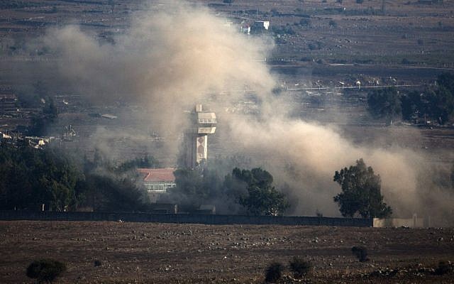 In a picture taken from the Golan Heights, smoke billows from the Syrian village of Quneitra following an explosion during fighting, between forces loyal to Syrian President Bashar Assad and rebels, near the Quneitra border crossing on August 31, 2014. (photo credit: AFP/MENAHEM KAHANA) In a picture taken from the Golan Heights, smoke billows from the Syrian village of Quneitra following an explosion during fighting, between forces loyal to Syrian President Bashar Assad and rebels, near the Quneitra border crossing on August 31, 2014. (photo credit: AFP/MENAHEM KAHANA)