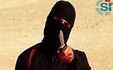 An image grab taken from a video released by the Islamic State (IS) shows a masked militant holding a knife and gesturing as he speaks to the camera in a desert landscape before a beheading. (AFP Photo/SITE Intelligence Group/HO)