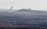 Smoke billowing from the Syrian village of Qahtaniya, near the border with Israel, following explosions during fighting between forces loyal to Syrian President Bashar Assad and rebel fighters, on September 5, 2014. (photo credit: AFP/Jack Guez)