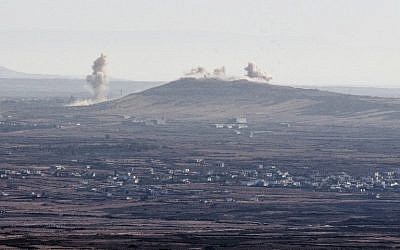 Smoke billowing from the Syrian village of Qahtaniya, near the border with Israel, following explosions during fighting between forces loyal to Syrian President Bashar Assad and rebel fighters, on September 5, 2014. (photo credit: AFP/Jack Guez)