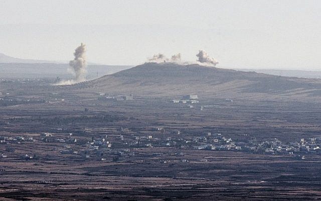 Smoke billowing from the Syrian village of Qahtaniya, near the border with Israel, following explosions during fighting between forces loyal to Syrian President Bashar Assad and rebel fighters, on September 5, 2014. (photo credit: AFP/Jack Guez) Smoke billowing from the Syrian village of Qahtaniya, near the border with Israel, following explosions during fighting between forces loyal to Syrian President Bashar Assad and rebel fighters, on September 5, 2014. (photo credit: AFP/Jack Guez)
