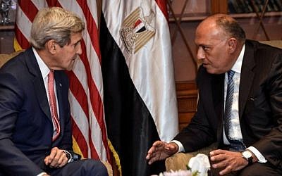 US Secretary of State John Kerry (left) meets with Egyptian Foreign Minister Sameh Shoukry on September 13, 2014 in Cairo. (AFP/ MOHAMED EL-SHAHED)