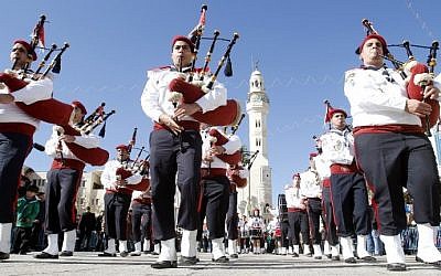 Orthodox Christmas celebrations kick off in the traditional birthplace of Jesus in the West Bank town of Bethlehem to the sound of bagpipes in 2012. (photo credit: AFP Photo/Musa aL-Shaer)
