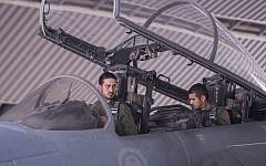 Saudi Arabian air force pilots sit in the cockpit of a fighter jet at an undisclosed location on September 23, 2014, after taking part in a mission to strike Islamic State targets in Syria (photo credit: AFP/Handout -- Saudi Press Agency)