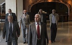 Chief Palestinian negotiator Azzam al-Ahmad (C) of the mainstream Fatah movement walks to a meeting with a Hamas delegation at a hotel in Cairo following reconciliation talks on September 24, 2014 in the Egyptian capital. (photo credit AFP/Khaled Desouki)