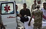 Former Egyptian president Hosni Mubarak is wheeled out of an ambulance outside the Maadi military hospital in Cairo on September 27, 2014, before boarding a helicopter that transported him to court. (photo credit: AFP/Khaled Desouki)