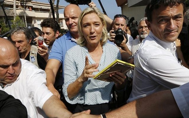 France's far-right National Front leader Marine Le Pen leaves after delivering a speech during the party's summer youth congress in Frejus on September 7, 2014. photo credit: AFP/VALERY HACHE) France's far-right National Front leader Marine Le Pen leaves after delivering a speech during the party's summer youth congress in Frejus on September 7, 2014. photo credit: AFP/VALERY HACHE)