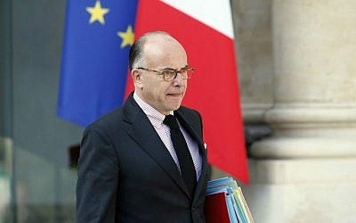 French Interior Minister Bernard Cazeneuve leaving a cabinet meeting at the presidential Elysee palace, Paris, on September 10, 2014. (photo credit: AFP/Patrick Kovarik)