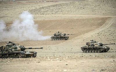 Turkish army tanks take up positions near the Syrian border on September 29, 2014. (photo credit: AFP/BULENT KILIC)