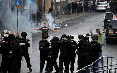 Illustrative photo of a Palestinian arguing with Israeli police during clashes in East Jerusalem (photo credit: AFP/ AHMAD GHARABLI) Illustrative photo of a Palestinian arguing with Israeli police during clashes in East Jerusalem (photo credit: AFP/ AHMAD GHARABLI)
