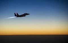Illustrative photo of a US Air Force F-15E Strike Eagle flying over northern Iraq on September 23, 2014, after conducting airstrikes in Syria. (AFP/US Air Force/Senior Airman Matthew Bruch)