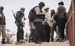 File photo dated June 02, 2011 courtesy Etienne de Malglaive shows American journalist Steven Sotloff (center with dark helmet) talking to Libyan rebels on Al Dafniya front line, 25 km west of Misrata. (Photo credit:AFP PHOTO HANDOUT- © ETIENNE DE MALGLAIVE)