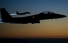 A pair of US Air Force F-15E Strike Eagles flying over northern Iraq early in the morning of September 23, 2014 after conducting airstrikes in Syria (Photo credit: AFP / US Air Forces Central Command via DVIDS / Senior Airman Matthew Bruch)