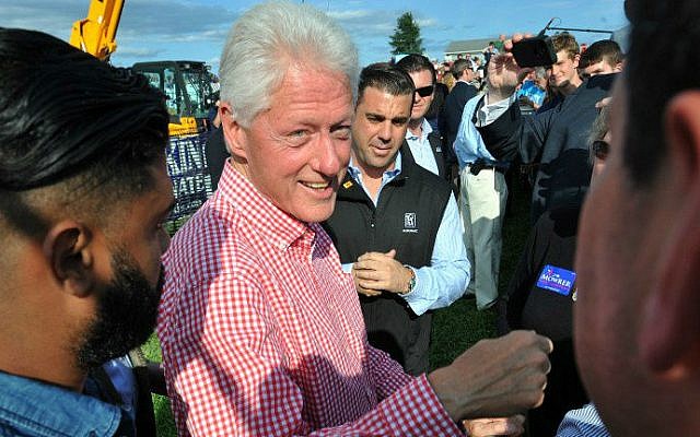 Former president Bill Clinton greets supporters after speaking to a large gathering at the 37th Harkin Steak Fry, September 14, 2014 in Indianola, Iowa. (photo credit:Steve Pope/Getty Images/AFP) Former president Bill Clinton greets supporters after speaking to a large gathering at the 37th Harkin Steak Fry, September 14, 2014 in Indianola, Iowa. (photo credit:Steve Pope/Getty Images/AFP)