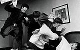 The Beatles -- from left, Paul McCartney, John Lennon, Ringo Starr and George Harrison -- letting off steam with a pillow fight. (photo credit: Harry Benson/JTA)