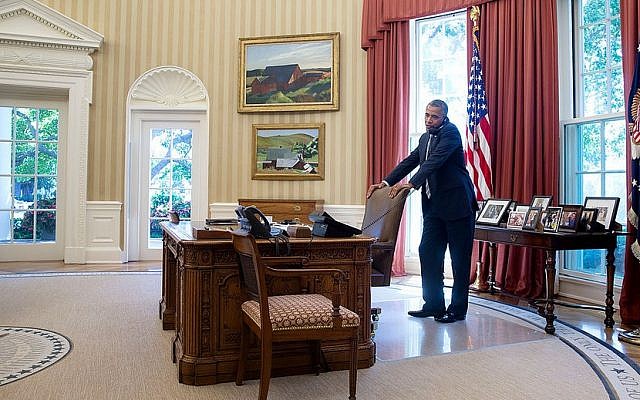 US President Barack Obama talks on the phone in the Oval Office, July 25, 2014. (photo credit: Pete Souza/White House) US President Barack Obama talks on the phone in the Oval Office, July 25, 2014. (photo credit: Pete Souza/White House)
