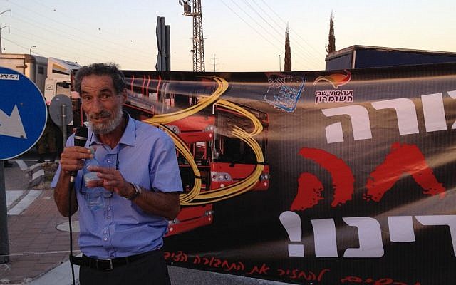 Benny Katzover, head of the Samaria Settlers Committee, speaks at a rally demanding that Palestinian laborers be removed from Israeli buses, September 4, 2014 photo credit: Elhanan Miller/Times of Israel)