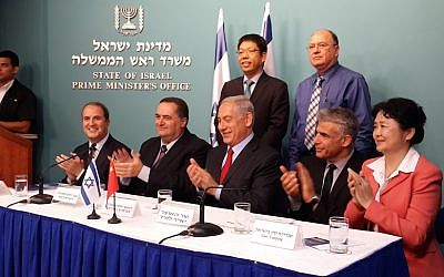 Officials applaud the new port deal (Photo credit: GPO)